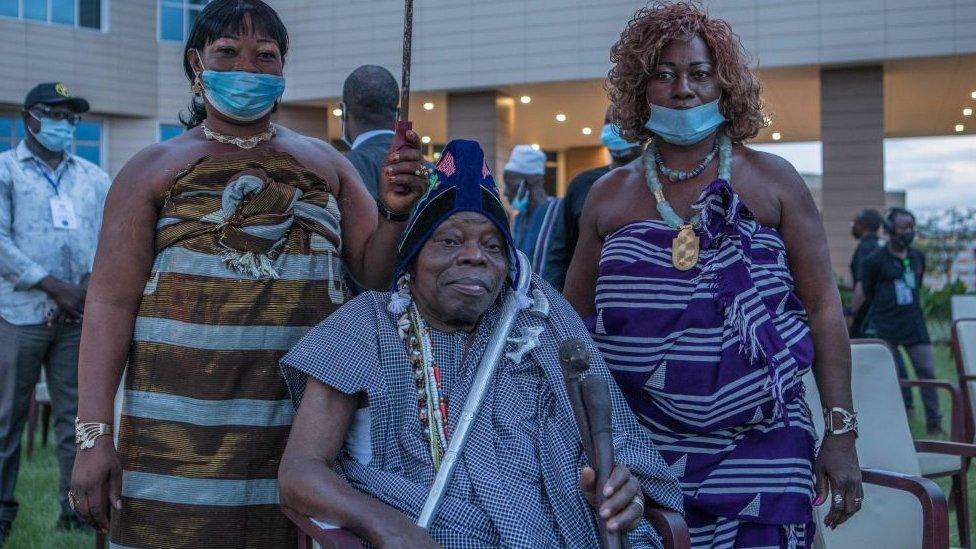 Dah Sagbadjou Glele (C), is seen during a ceremony where artefacts, some considered sacred in Benin, arrived at the presidential palace in Cotonou on November 10, 2021