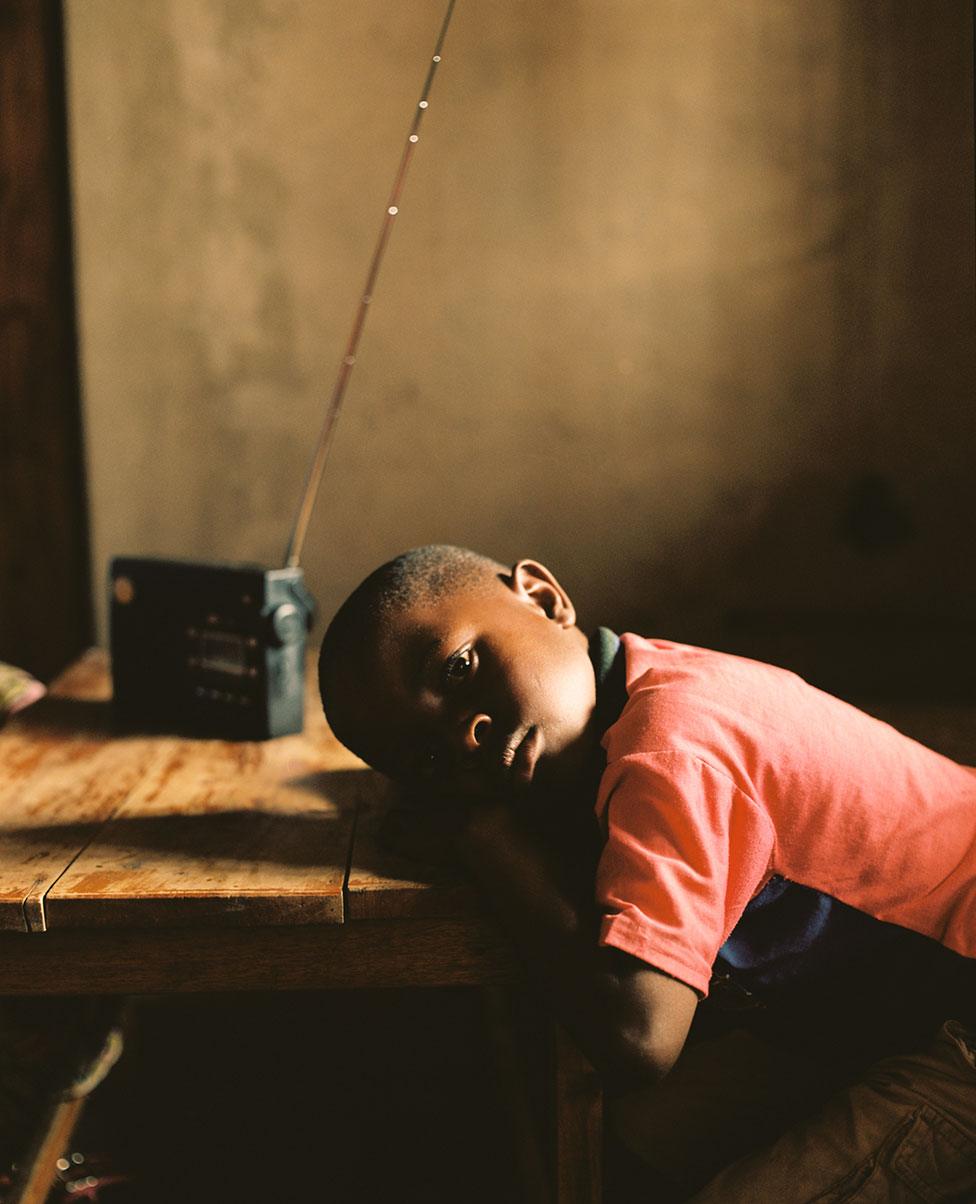 Danny listens to a radio in his home