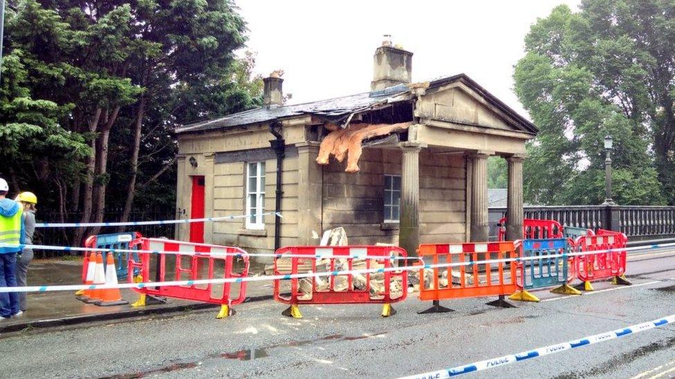 Partially destroyed tollhouse