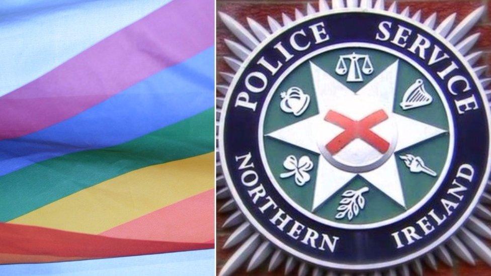 rainbow flag and psni logo