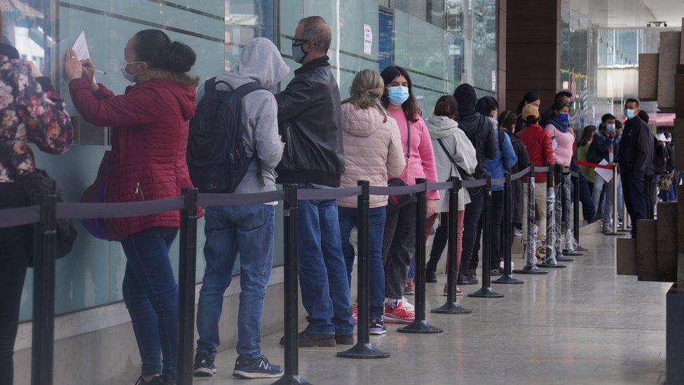 A queue at a vaccination centre in a shopping centre in Bogotá