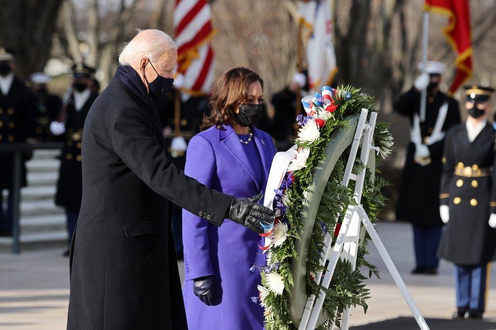 President Joe Biden and Vice President Kamala Harris lay a large wreath together