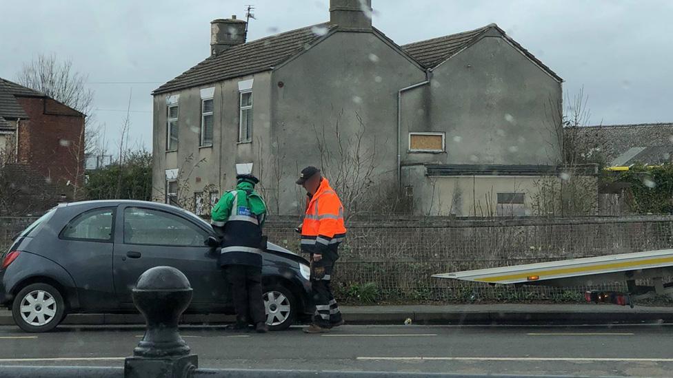 Warden issuing parking ticket