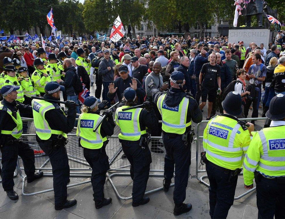 Police were present with protesters and members of the press.