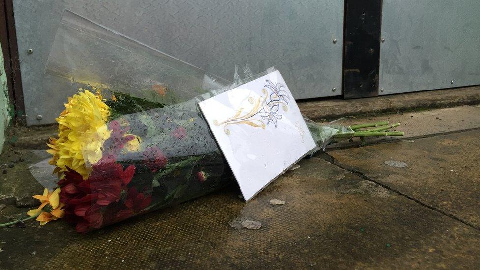 Flowers left on the steps of the mosque