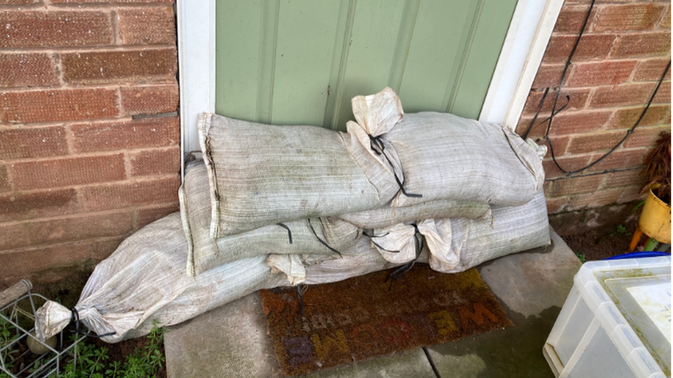 Sandbags outside their home