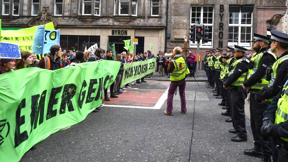 Climate change protesters block one of the main roads into Edinburgh's city centre on April 16, 2019 in Edinburgh