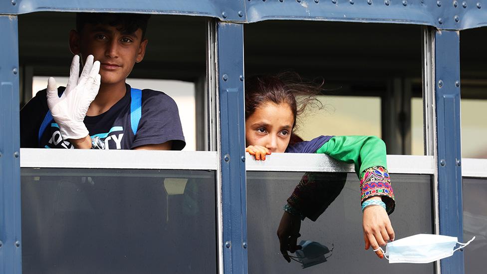 Young Afghan evacuees arrive in a bus after their arrival to Ramstein Air Base in Germany - 26 August 2021