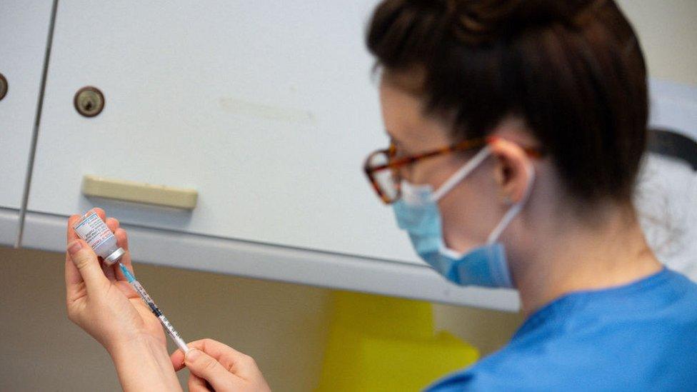 nurse preparing vaccine