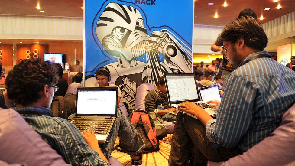 Participants use their laptop computers during the fifth edition of Open Hack India