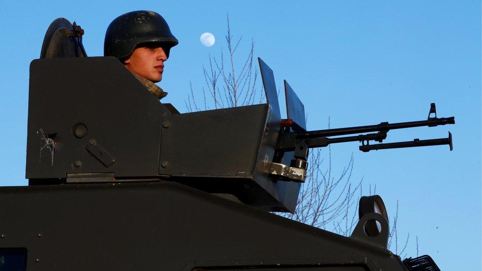 A Turkish soldier in an armoured personnel carrier (APC) at a checkpoint near the Turkish-Syrian border in Kilis province, Turkey, 29 January 2018