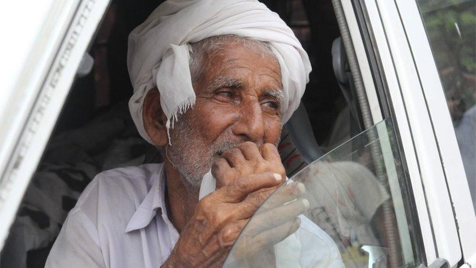 Father of social media celebrity, Qandeel Baloch mourns as he sits in an ambulance carrying the body of Qandeel in Shah Sadar Din village, around 130 kilometers from Multan on July 17, 2016.