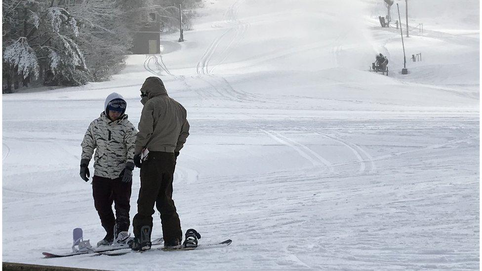 Snowboarders in NH