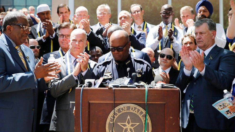 Dallas, Texas Police Chief David Brown (C) speaks about the police officers killed overnight during a prayer service at Thanks-Giving Square in Dallas, Texas,