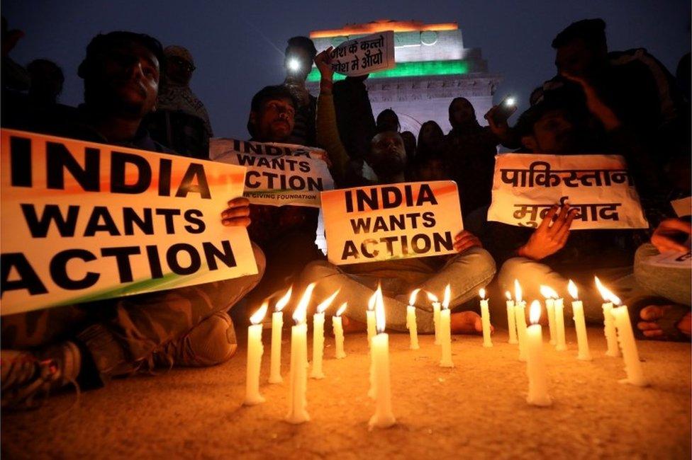 People attend a candle light vigil to pay tribute to Central Reserve Police Force (CRPF) personnel who were killed after a suicide bomber rammed a car into the bus carrying them in south Kashmir on Thursday,