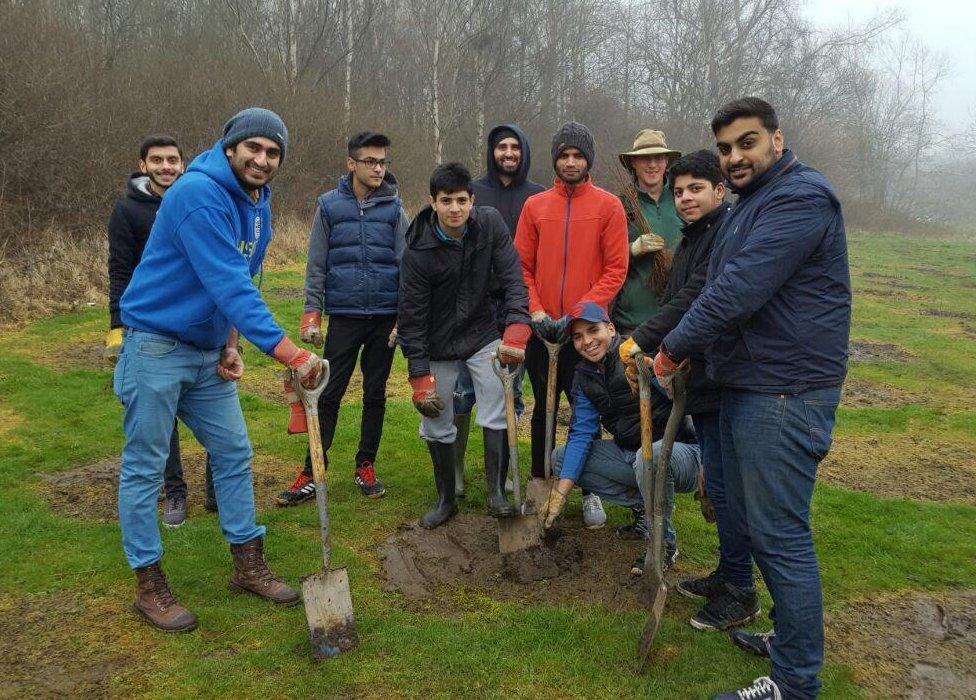 Members of The Ahmadiyya Muslim Youth Association planting trees