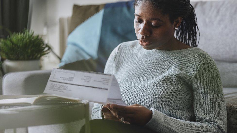 Woman looking at energy bill