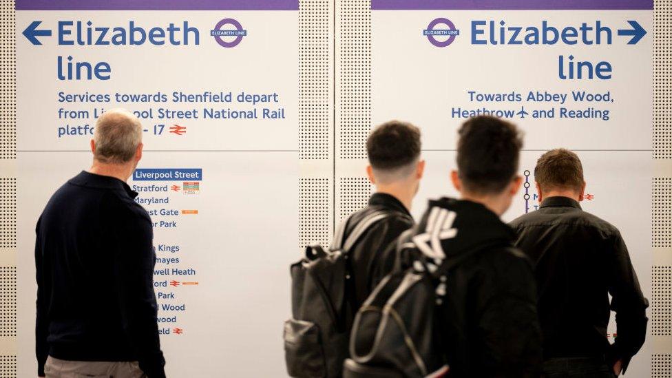 Passengers study Elizabeth line route maps