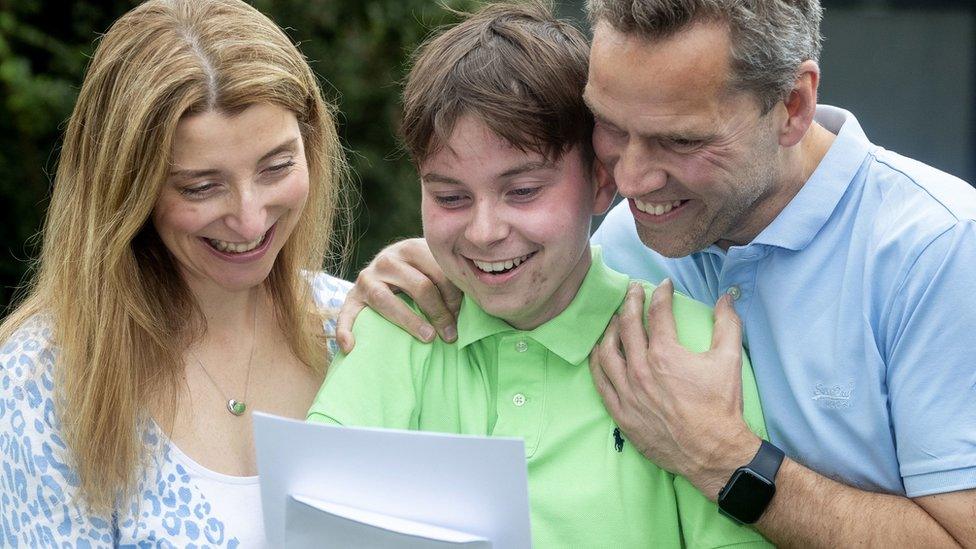 Seb with his mum and dad