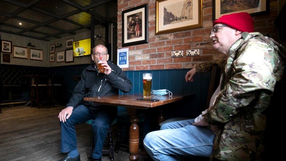 Two of the first customers to be served at The Scotsman's Lounge pub in Edinburgh