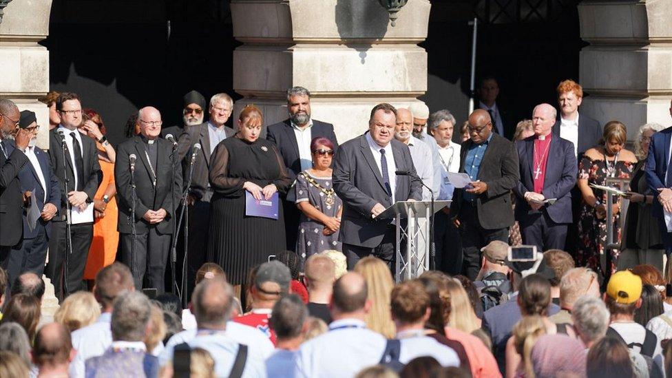 Speakers at vigil