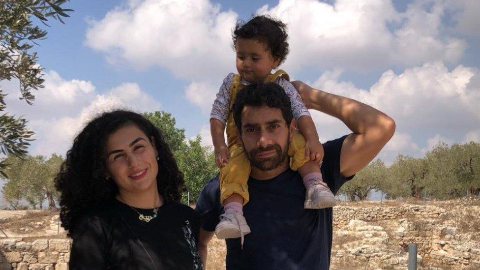 Zeina Ramadan, their young daughter, and Imad Alqasim