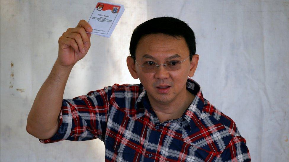 Governor of Indonesia's capital Basuki Tjahaja Purnama shows his ballot during an election for Jakarta's governor in Jakarta