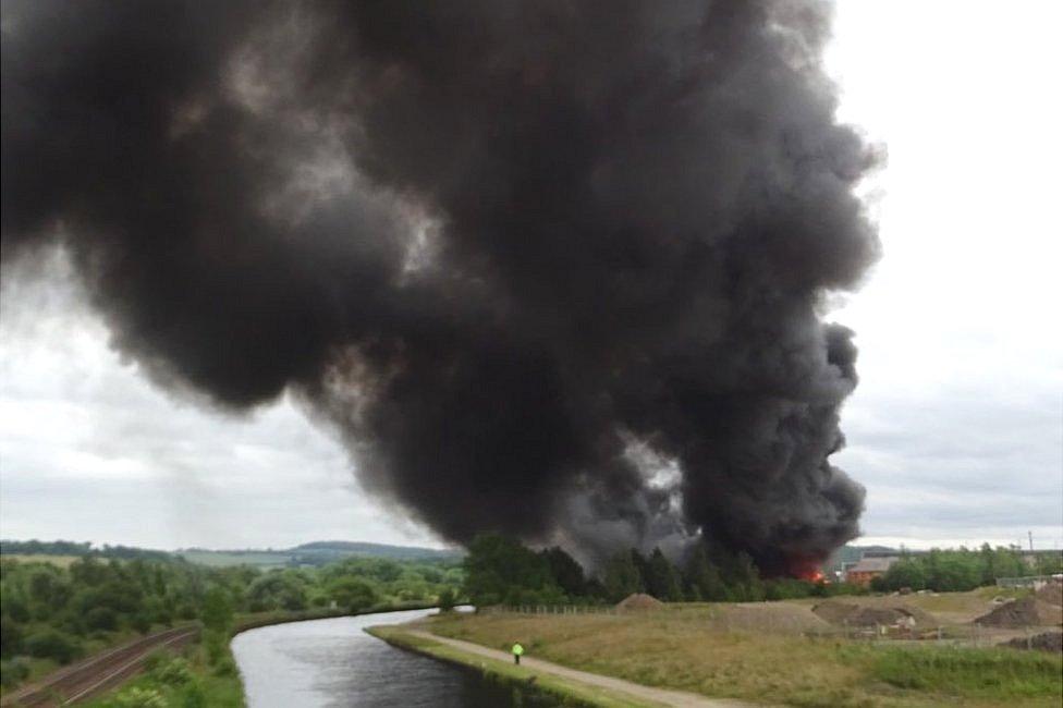 Smoke rising from the recycling plant