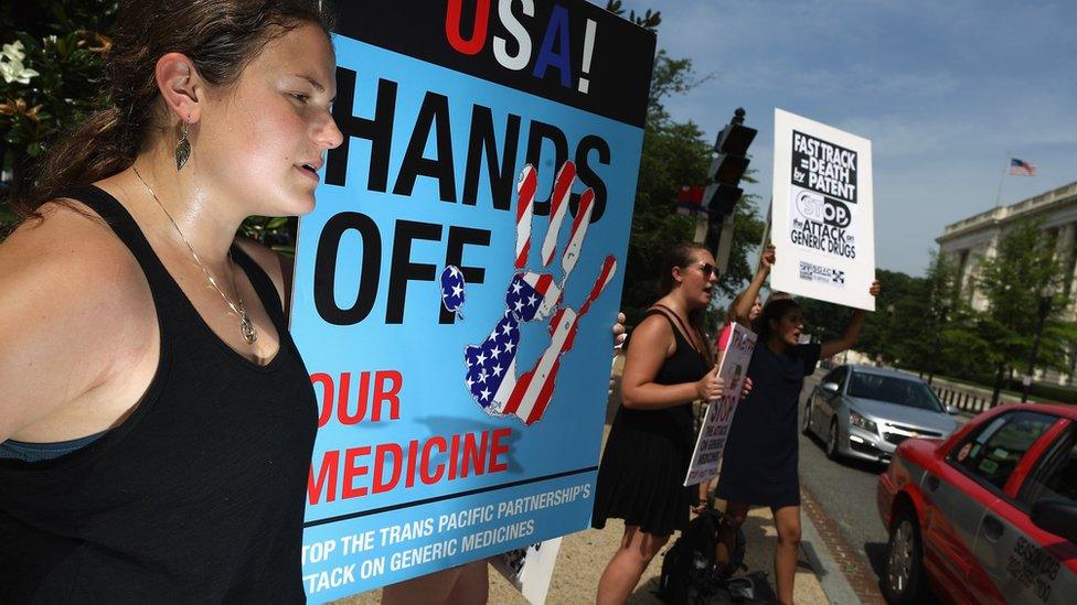 Demonstrators protest against the TPP trade agreement outside the Senate office buildings on Capitol Hill