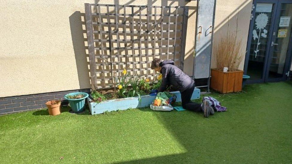 Claire Evans' mum helping with gardening