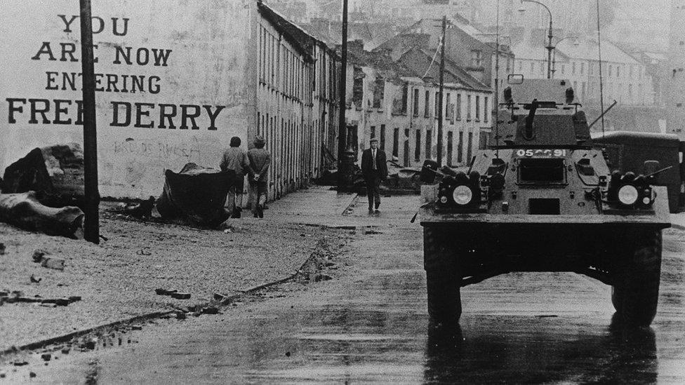 Army tank driving through Derry/L'derry