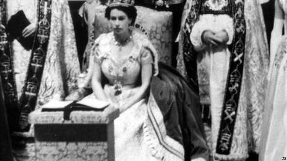 The Queen sits during her coronation in 1953