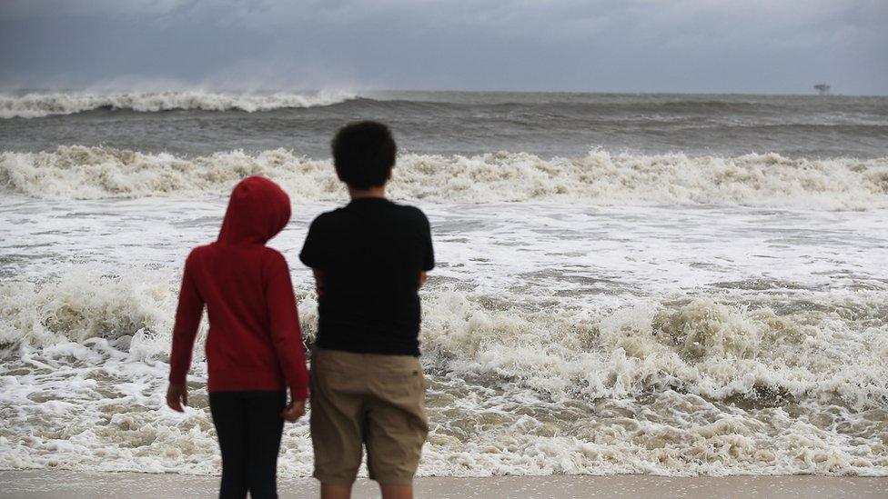 Waves crash on a beach at Dauphin Island, Alabama. 4 Sept 2018