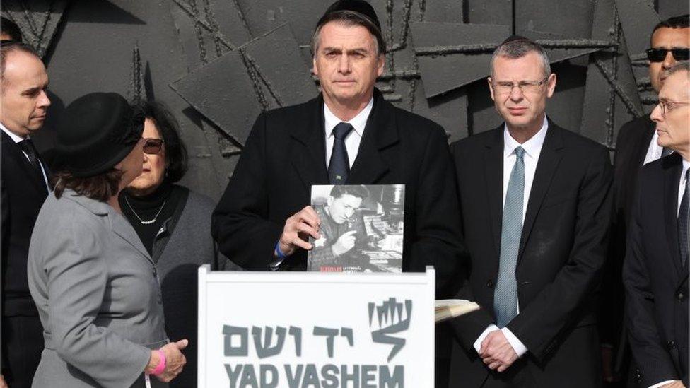 Brazilian President Jair Bolsonaro (C) during a memorial ceremony at the Hall of Remembrance in the Yad Vashem Holocaust memorial museum in Jerusalem, Israel, 02 April 2019.