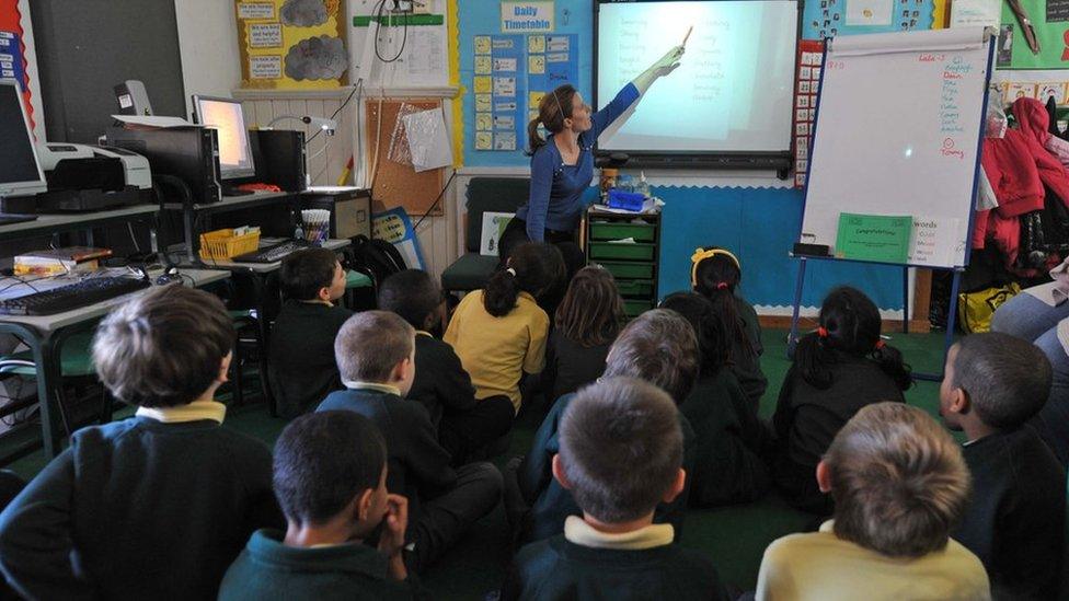 Children with teacher in classroom