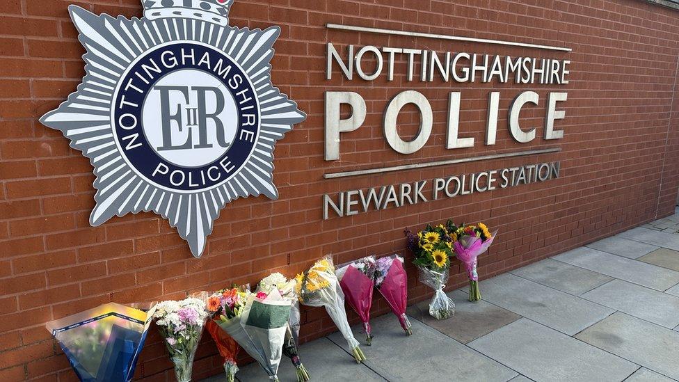 Flower tributes outside Newark Police Station