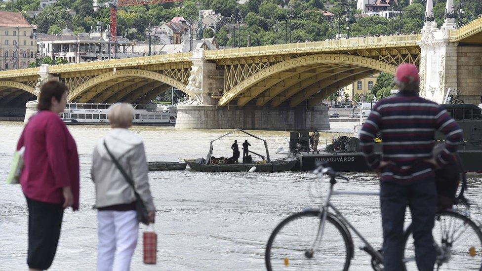 Rescuers search for bodies and survivors of the Danube tour boat accident in Budapest