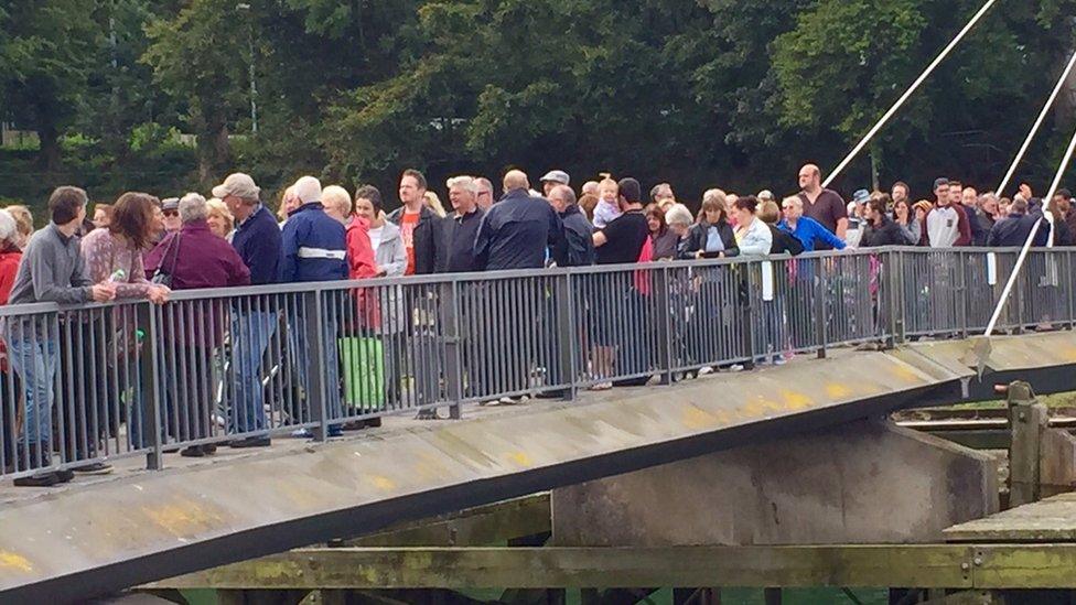 Pont yr Aber bridge with protestors lined up along its length