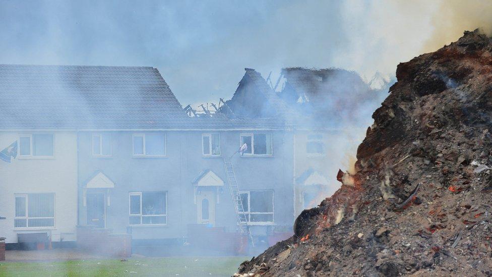 Fire-damaged houses at Hopewell Square in Belfast's Shankill area