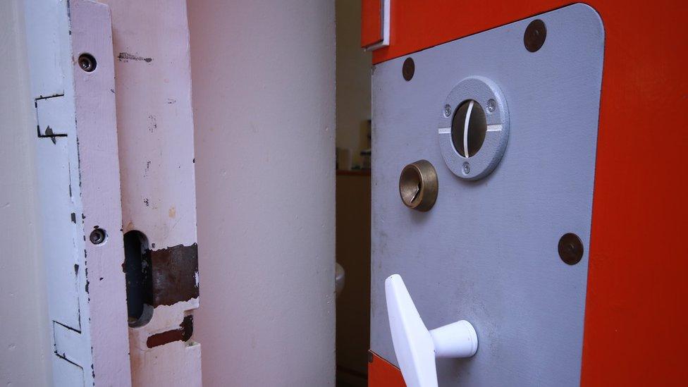 Door and lock of a prison cell