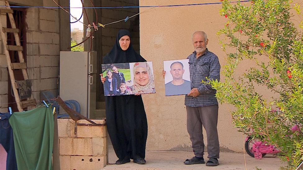 Parents outside house