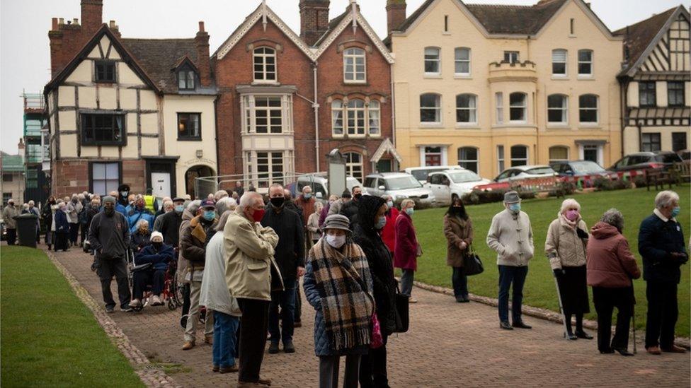 Members of the public queue outside Lichfield Cathedral,