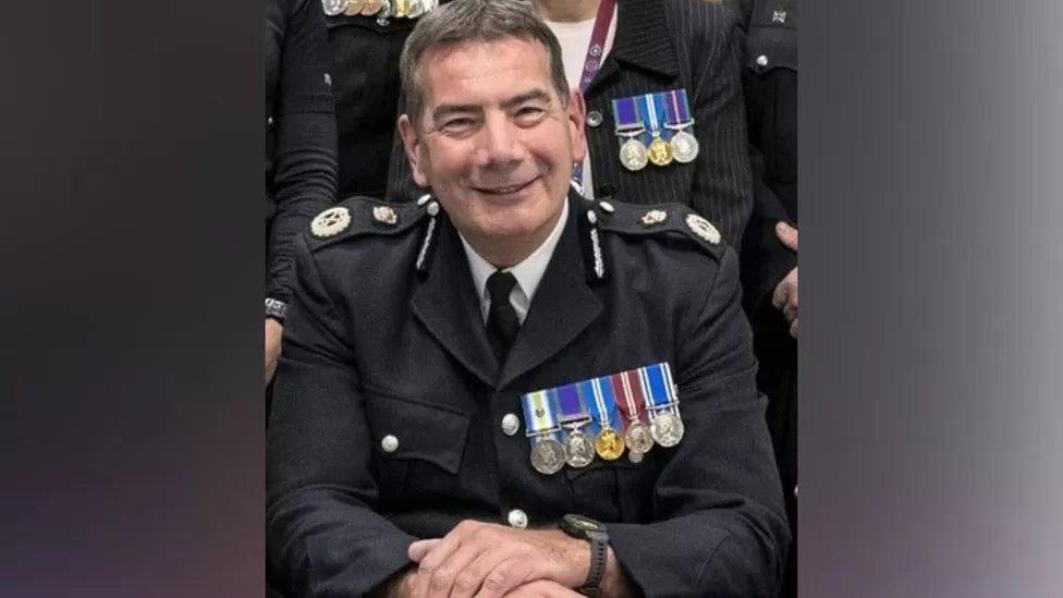 Man in police uniform wearing medals