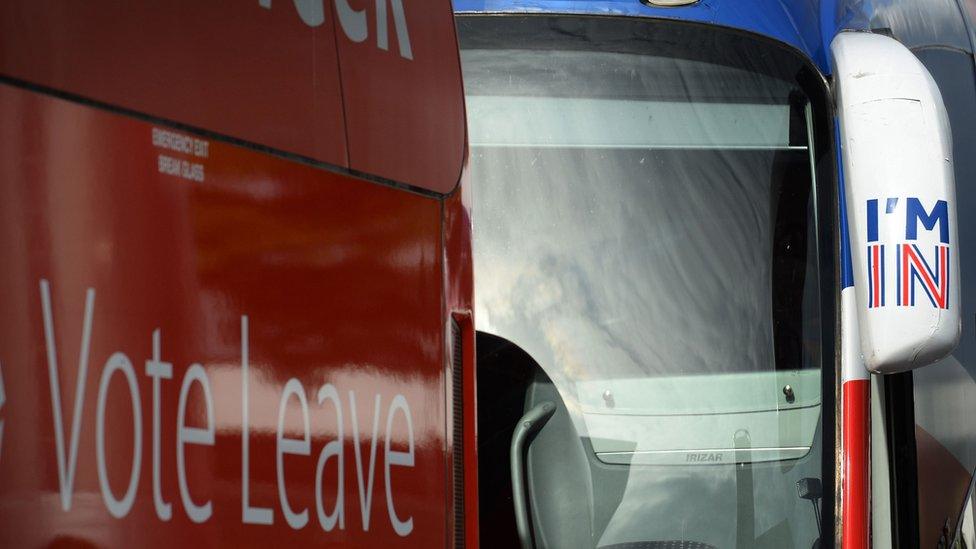 Rival buses are parked outside the venue