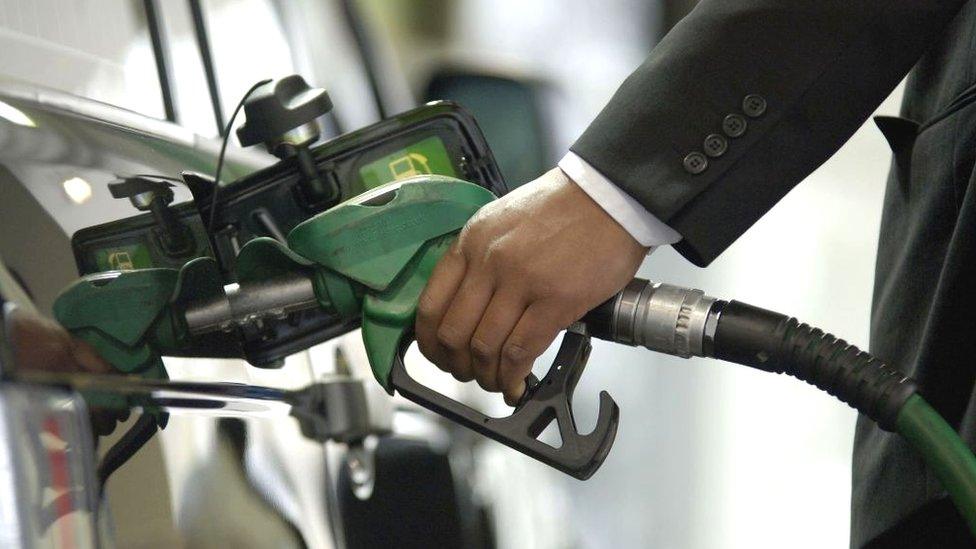 A man filling his car with petrol