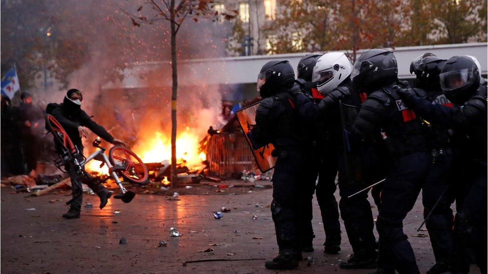 police and protesters in paris