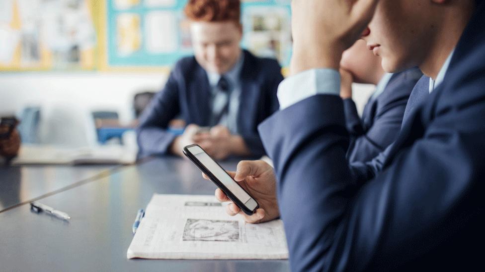 Schoolgirl with phone