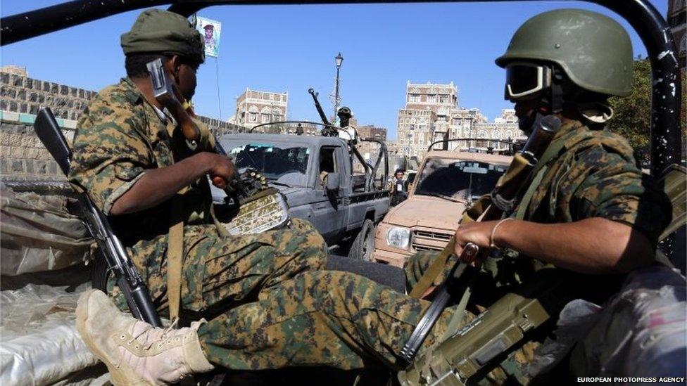 Newly recruited Houthi fighters ride vehicles during a gathering to mobilize more fighters to fight Saudi-backed Yemeni forces, in the old city of Sanaa