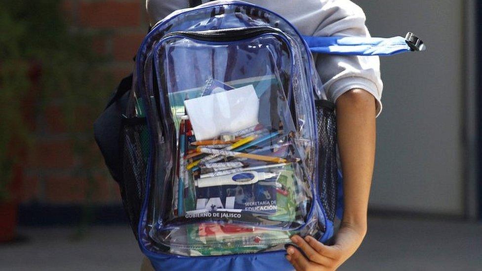 School student carrying clear backpack