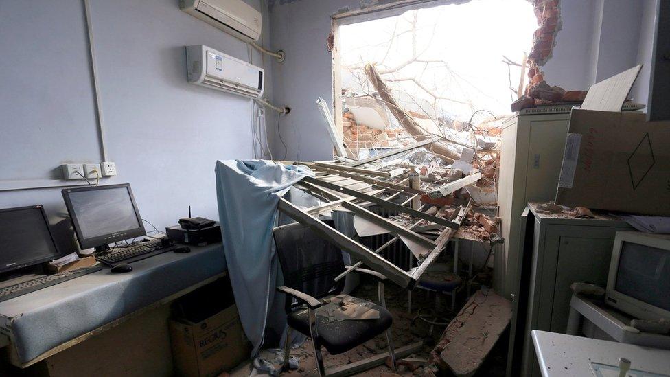 In this Thursday, Jan. 7, 2016 photo, rubble and debris spills into a room at the No. 4 Hospital of Zhengzhou University after the demolition